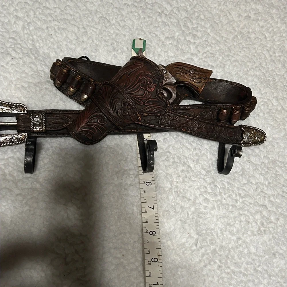 Gun belt wall hanger